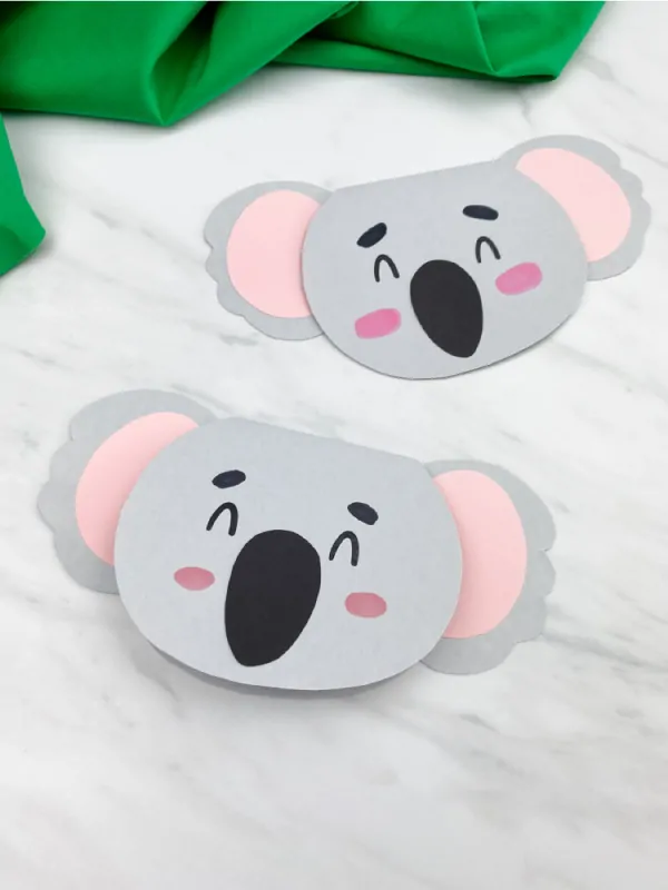 two gray koala cards with green fabric 