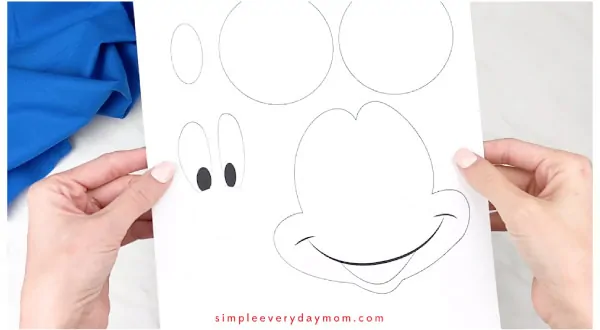 hands holding mickey mouse template