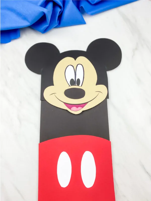 mickey mouse paper bag puppet craft with blue fabric 