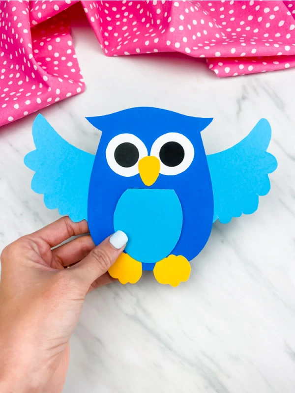 hand holding blue owl paper craft
