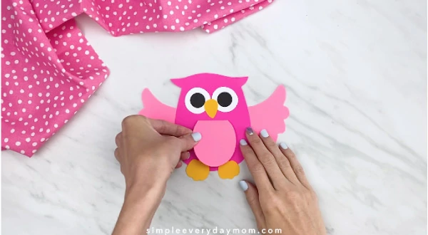hands gluing belly to owl card craft 