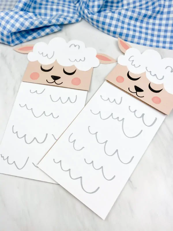 two sheep paper bag puppets