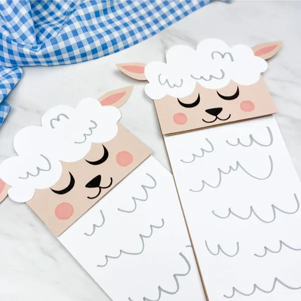Closeup of two paper bag sheep crafts 