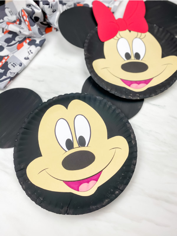 paper plate mickey mouse craft with paper plate minnie mouse in background 