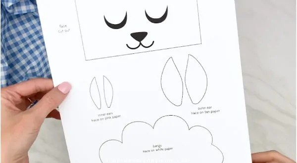 Hands holding paper bag sheep craft template 