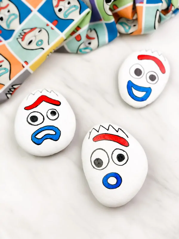 3 forky painted rocks with different emotions 