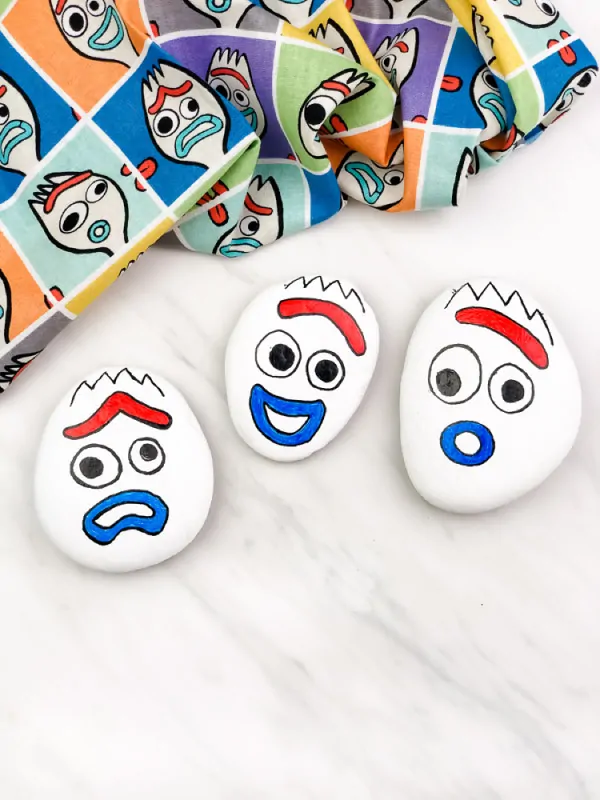 3 forky rocks with different emotions 