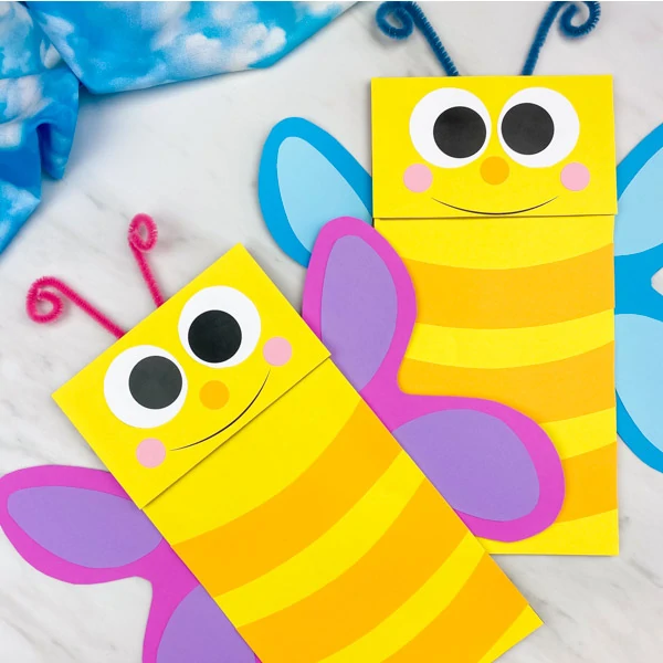 two paper bag butterfly puppets