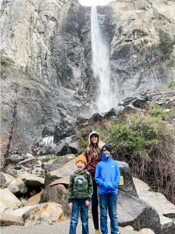 Mom with two kids at Bridalveil falls at Yosemite 