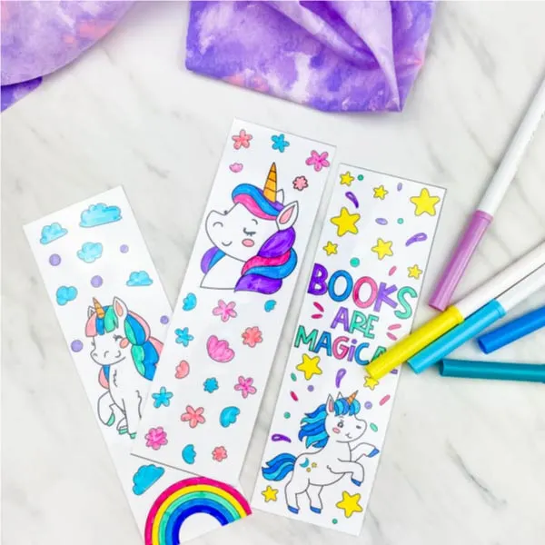 3 unicorn coloring page bookmarks colored in with markers 