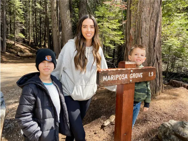 mom with two kids at trailhead of Maripose Grove 