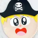 closeup of paper plate pirate boy with blonde hair