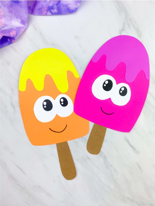 two ice cream paper crafts on marble background 