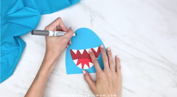 hands drawing on shark nostrils 