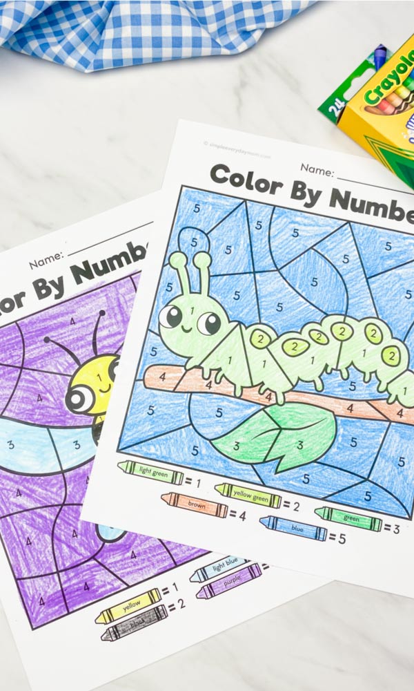 caterpillar and bee color by number printable on marble background with crayons in corner 