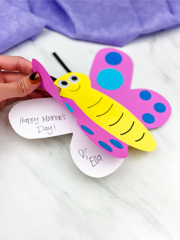 hand opening butterfly card craft to read inside of text "happy mother's day! love, Ella"