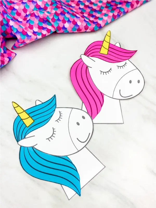 blue and pink maned unicorn craft with marble background and colorful fabric 