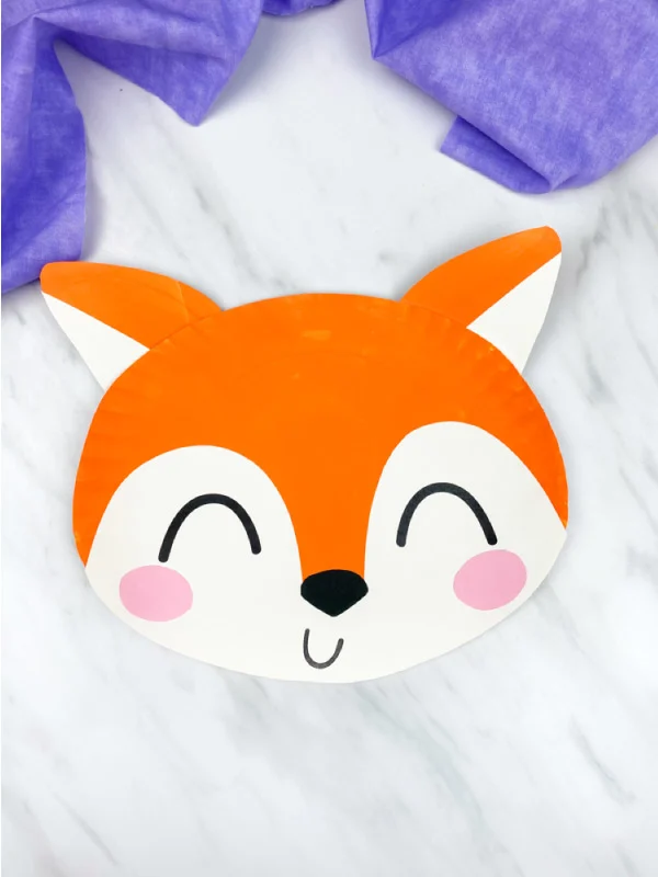 paper plate fox on marble background with purple fabric 