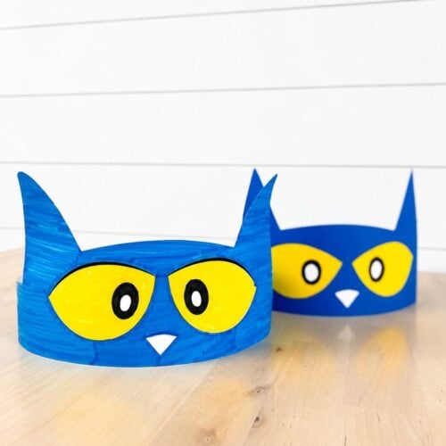 Close-up of two blue Pete the Cat headbands, with the hand-colored version in front.