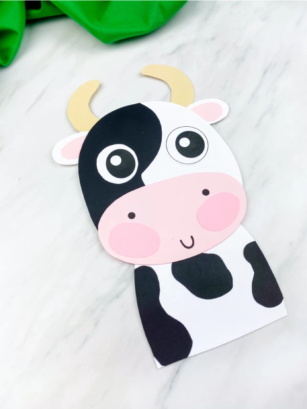 closeup of black and white paper cow 