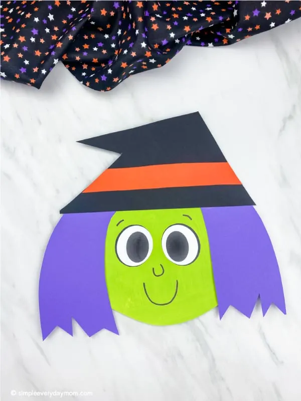 light green and purple haired paper plate witch