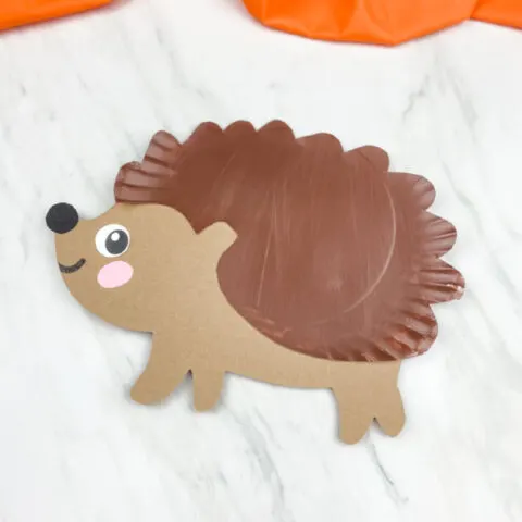 dark brown paper plate hedgehog craft at an angle