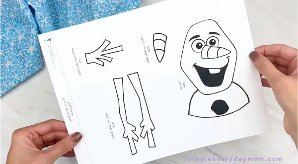hands holding Olaf craft template