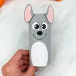 Hand holding toilet paper roll mouse craft
