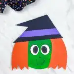 dark green and orange haired paper plate witch