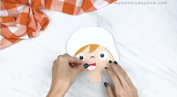 hands gluing mouth to paper pilgrim