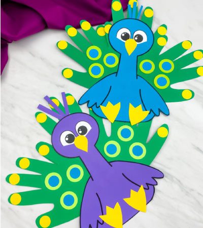 blue and purple handprint peacock crafts