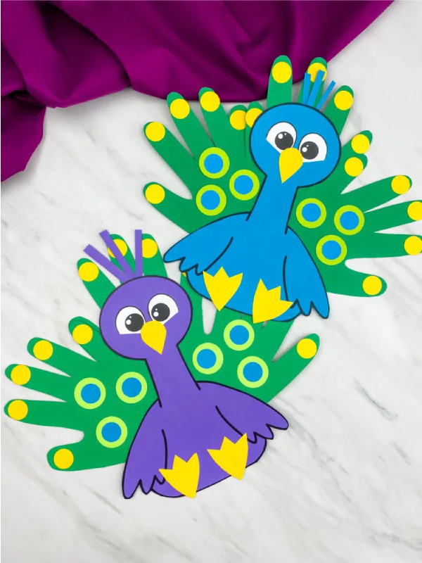 blue and purple handprint peacock crafts