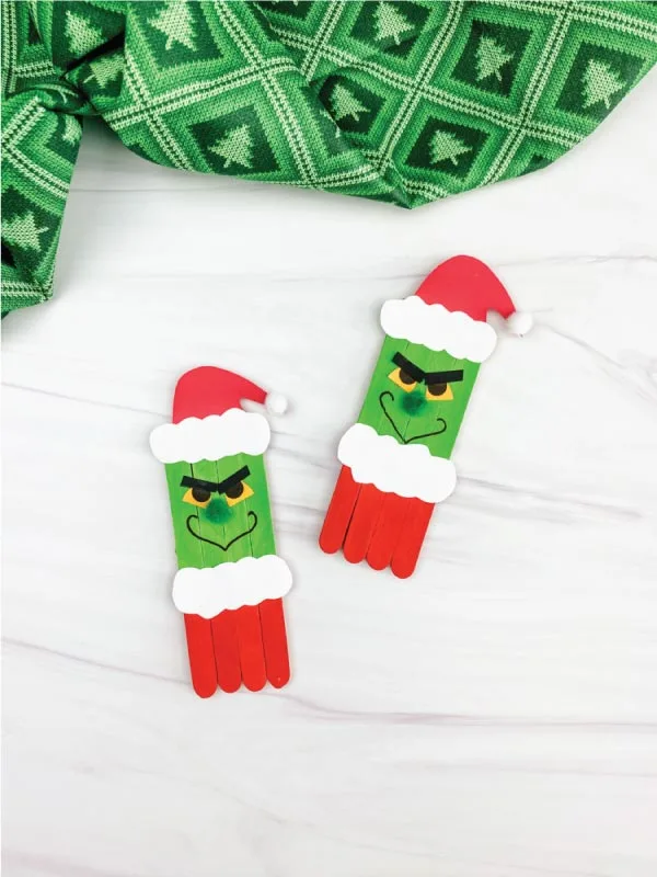 two popsicle stick grinch crafts