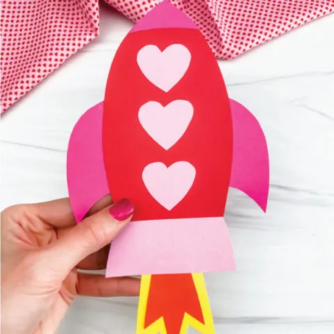 hand holding rocket valentine craft