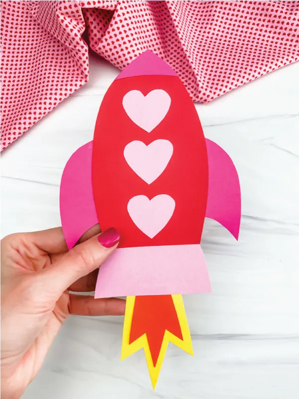 hand holding rocket valentine craft