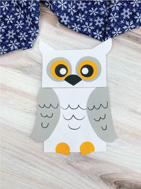 white and gray paper bag snowy owl