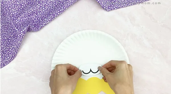 hand gluing mouth to paper plate Easter bunny craft