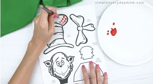 hand painting dots on cat in the hat craft with back of pencil eraser