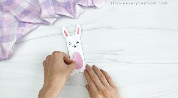 hand gluing belly to popsicle stick easter bunny craft
