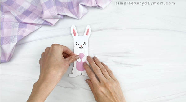 hand gluing arms to popsicle stick easter bunny craft