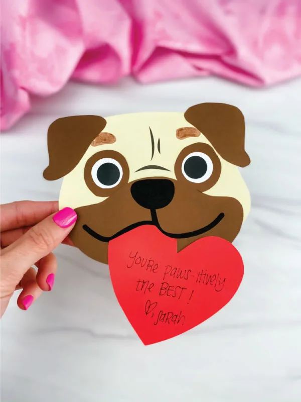 hand holding puppy valentine craft