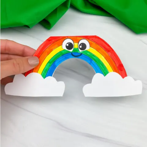 hand holding rainbow card craft