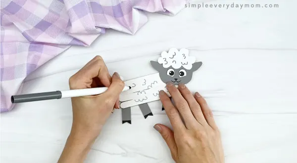 hand drawing on popsicle stick sheep craft