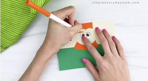 hand drawing eyebrows on toilet paper roll leprechaun craft