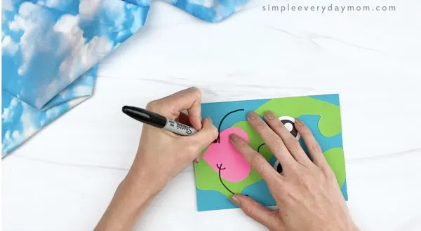 hand drawing arms on Earth card craft