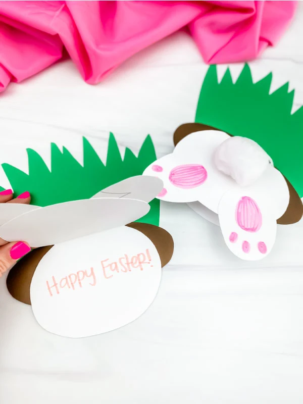 hand opening up Easter bunny butt card