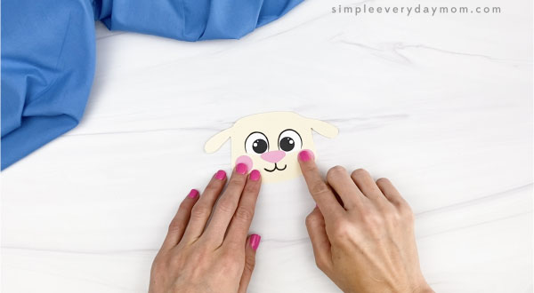 hand gluing cheeks to Easter sheep craft