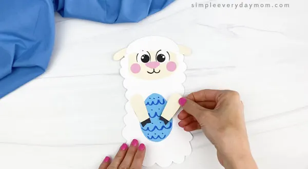 hand gluing arm to Easter sheep craft