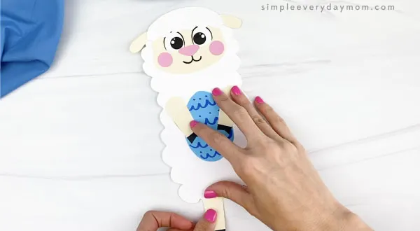 hand gluing leg to Easter sheep craft