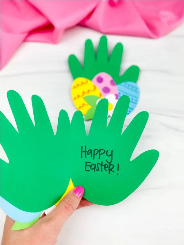 hand holding handprint Easter card craft open